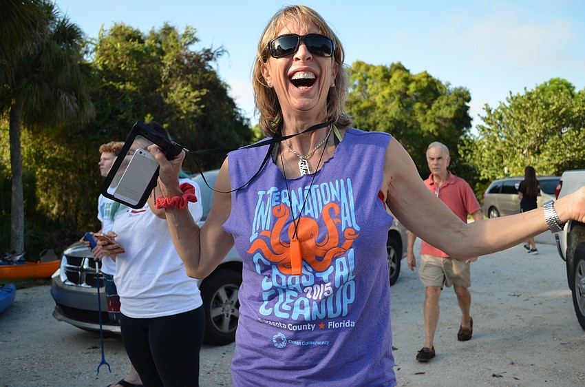 Mooshi Chapel shows off her Coastal Cleanup T-shirt.