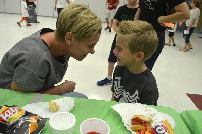 Scarlett and Hunter Handley share jokes during snack time.
