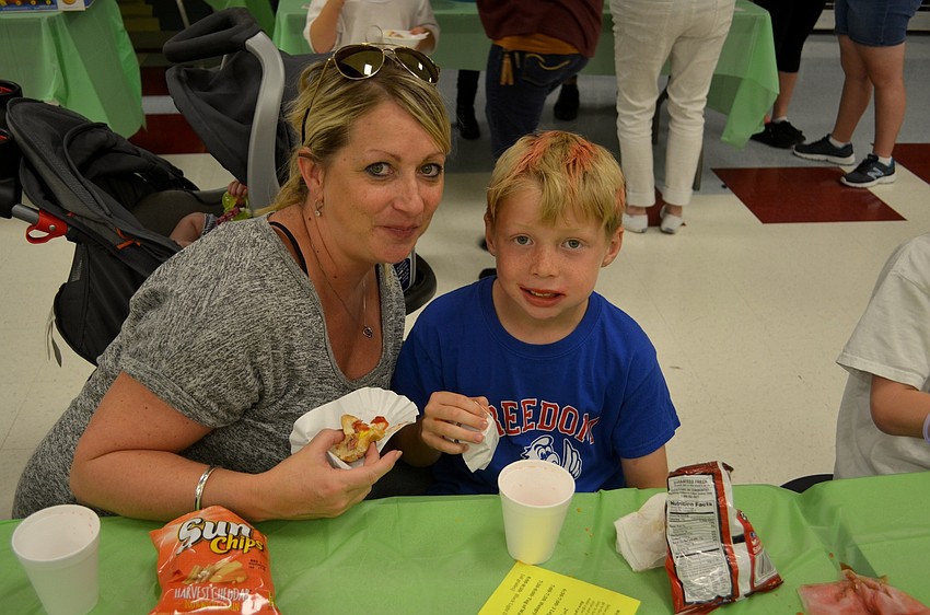 Angela and Brendon Tyquiengco enjoy some snacks before playing games.