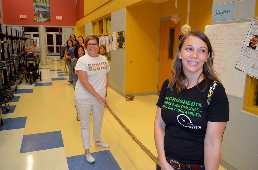 Mothers win against their sons in Tug of War.
