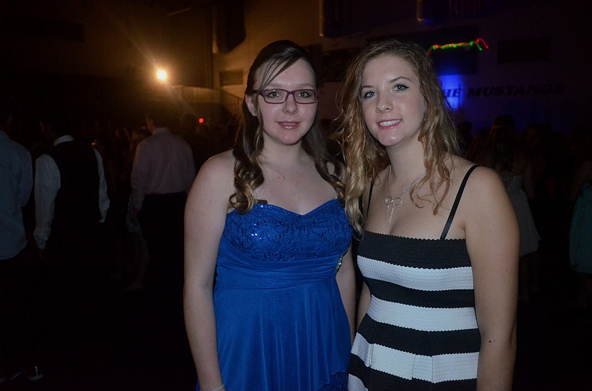 Hope Wilcox and Corinna Lunsford make their way to the dance floor.
