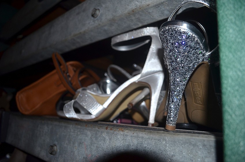 The ladies unhook their heels before heading to the dance floor.