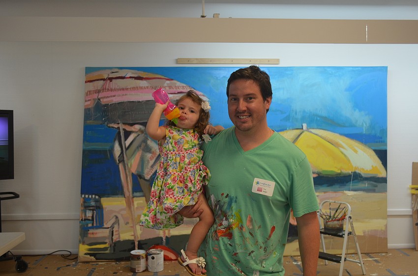 Artist Tim Jaeger and daughter, Nina Mae, 2, with “Against the Element”