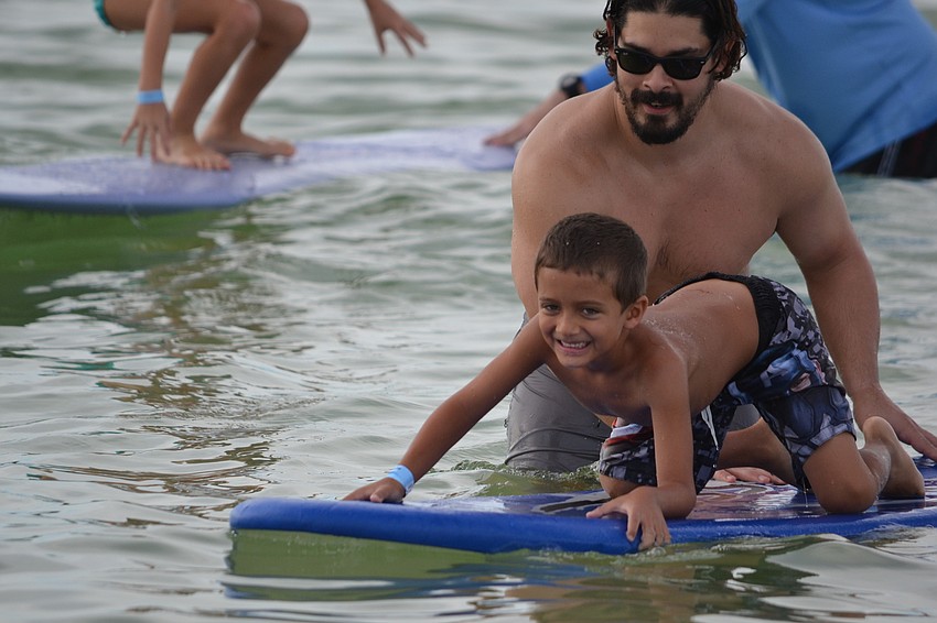 Luciano Iannotti tries to find his balance on a surfboard.