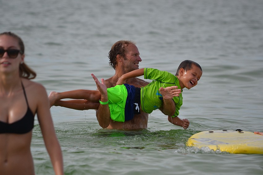 Volunteer Patrick Ryan and Gabriel Bishop have developed a bond in the three years that they have been paired for the Hang Ten for Autism event.