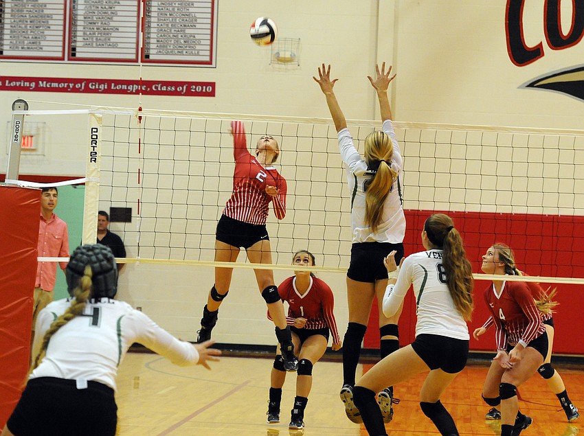 Cardinal Mooney outside hitter Madison McNally sends the ball back over the net.