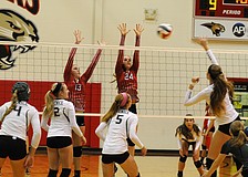 Cardinal Mooney's Brooke Picchi and Keri McMahon go up for a block in the first set.