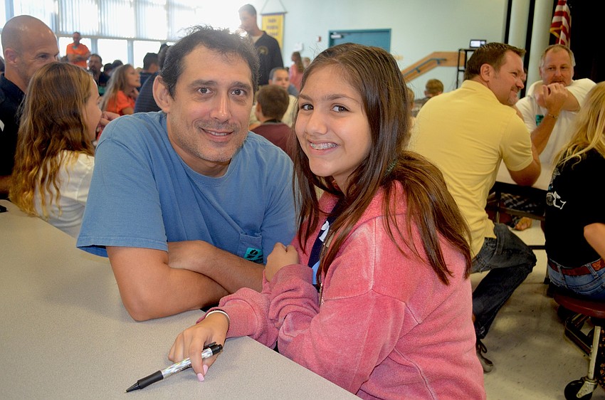 Ed and Elizabeth Keene wait for their turn to get breakfast.