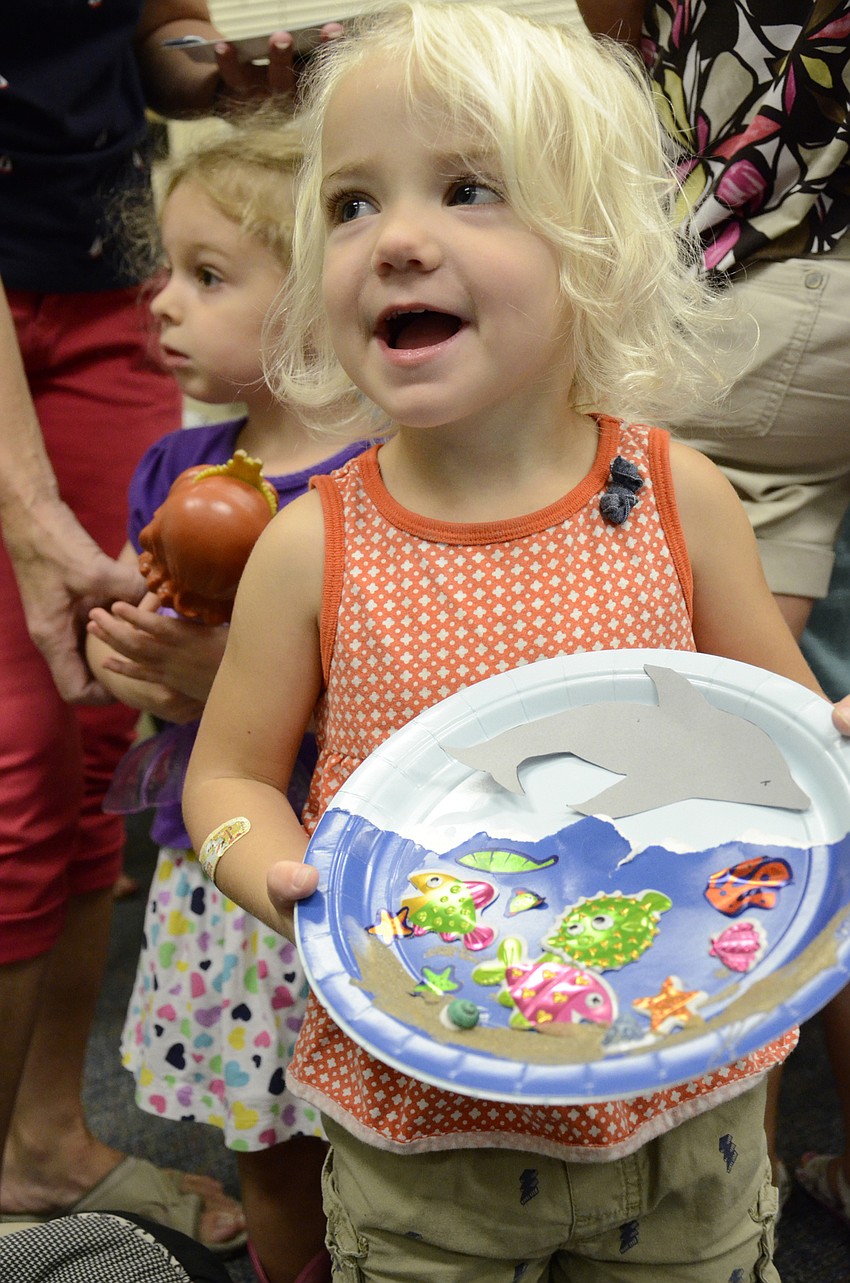 Chloe Sidnam shows off her finished piece.