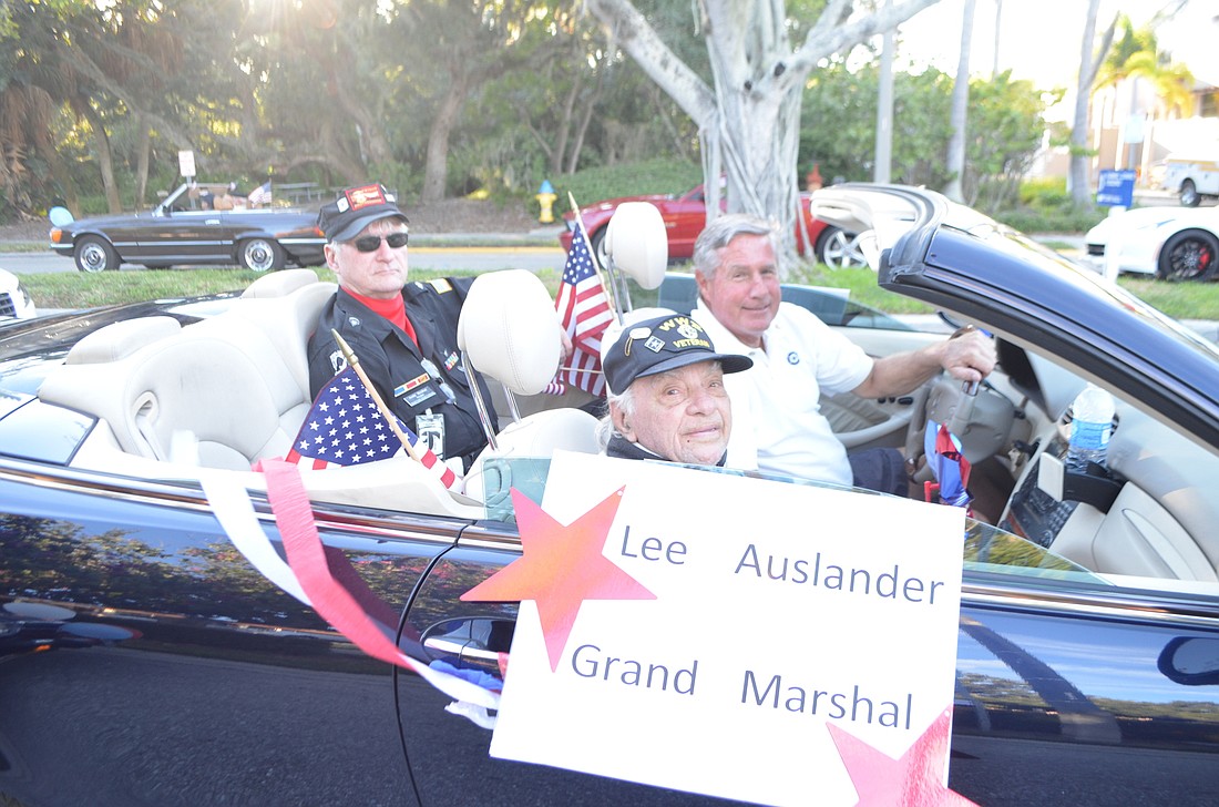 Last yearâ€™s Grand Marshal  and World War II veteran Lee Auslander, then 100, with Andy Hooker and Andy Sawyer.