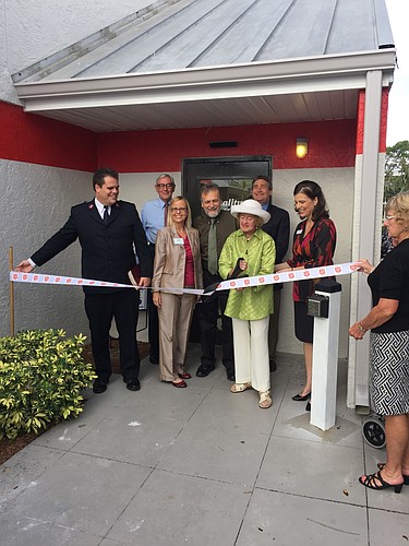Betty Schoenbaum officially opens the Quality of Life Center with a ribbon cutting ceremony Thursday, morning.