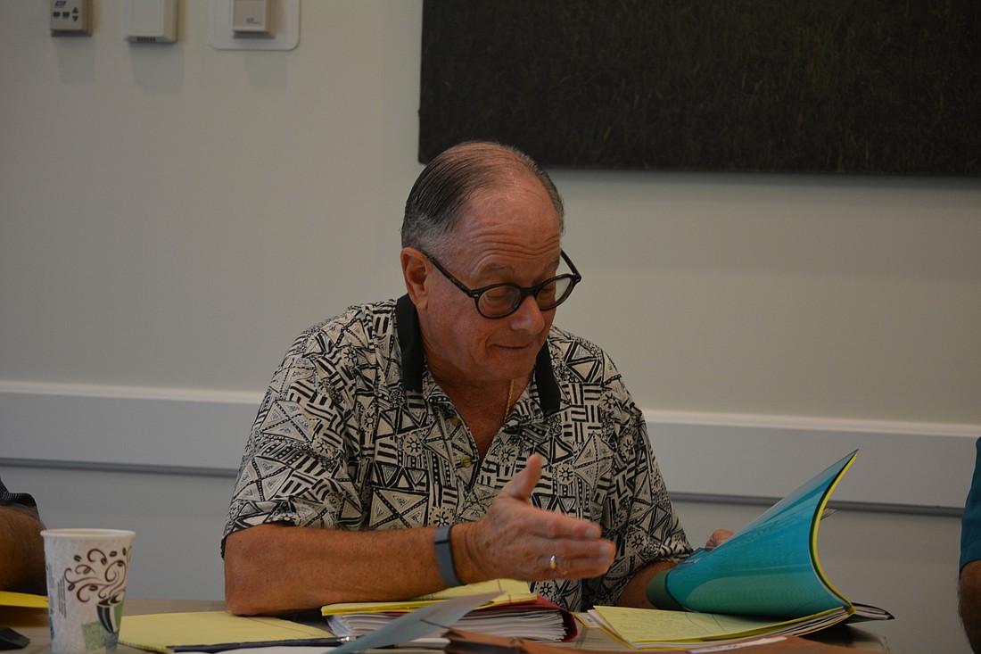 IDA Supervisor Alan Silverglat reviews his top candidates with fellow board members Sept. 30.