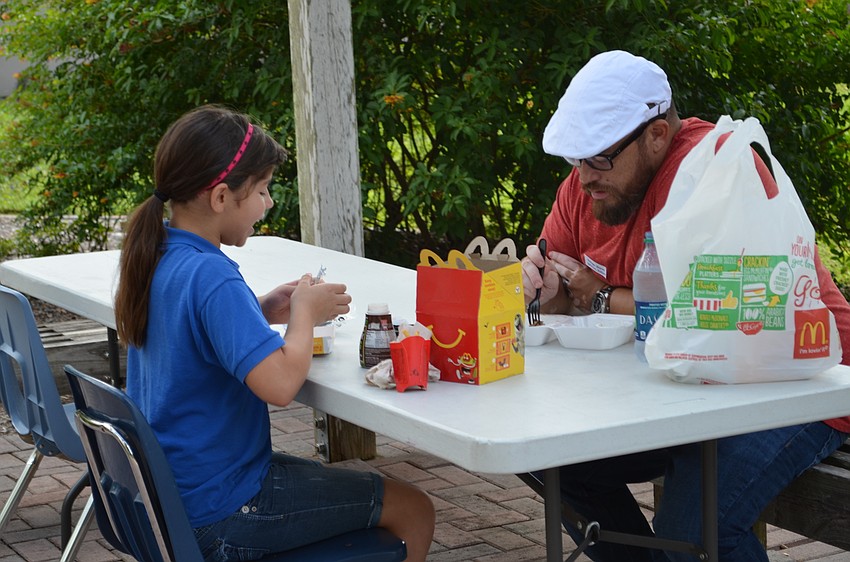 Selah Casal and her father Casey enjoy one-on-one time eating lunch together.
