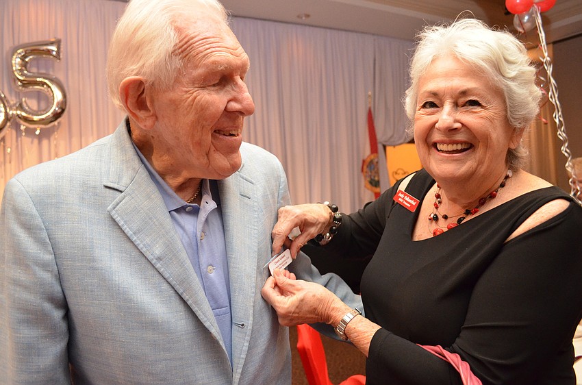Chuck Volkert receives his lifetime membership pin from Judy Falkenthal.