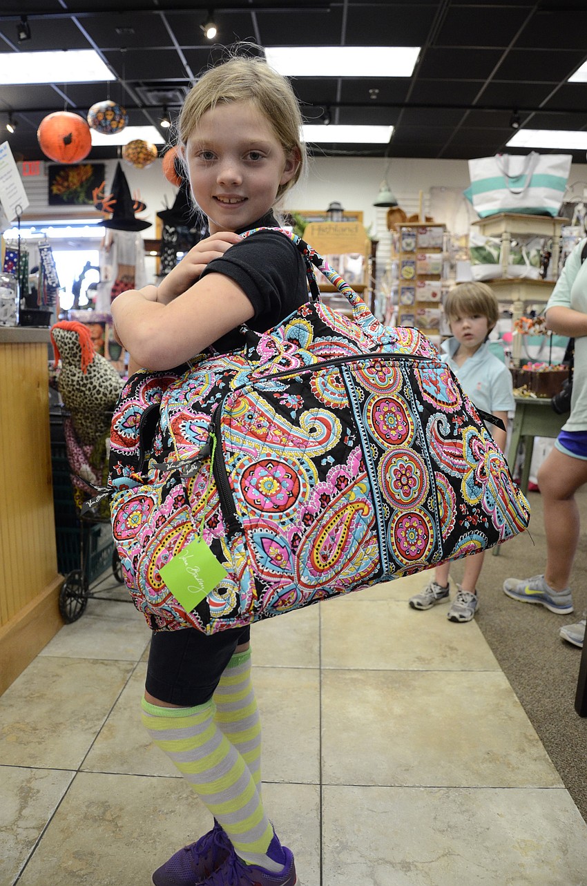 Emma Hoelly got a new tote during the fundraiser.