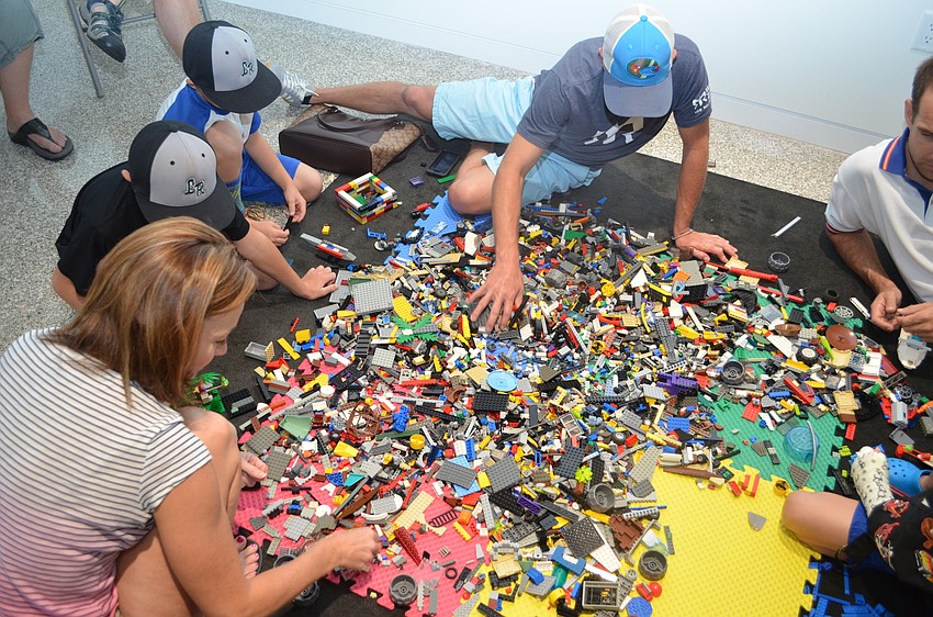 Parents and kids dived into mountains of LEGOs provided by Bricks 4 Kidz at the Center for Architecture Sarasota.