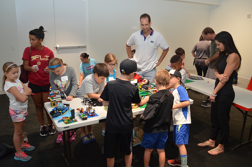 Parents and students admire their day's creations.