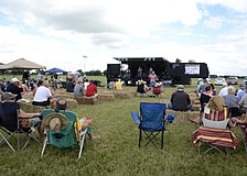 Attendees pulled up a chair to listen to local bands while enjoying their brews.