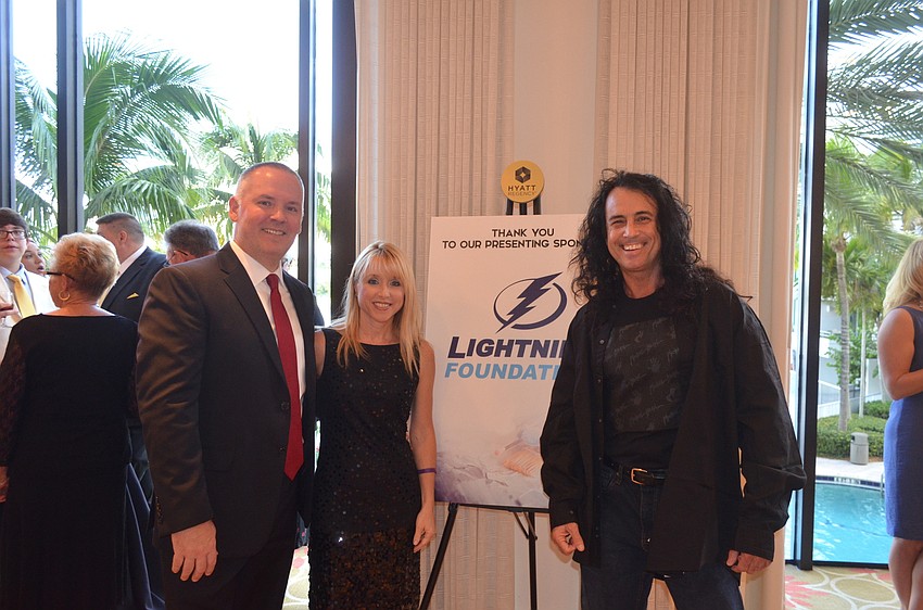 Payton Wright Foundation founders Patrick and Holly Wright with artist Michael Israel