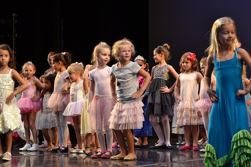 Young girls were welcomed on stage to learn from Sarasota Ballet dancers.
