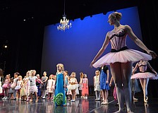 Sarasota Ballet dancer Caitlin Gish leads young dancers on the stage at the FSU Center for the Performing Arts.