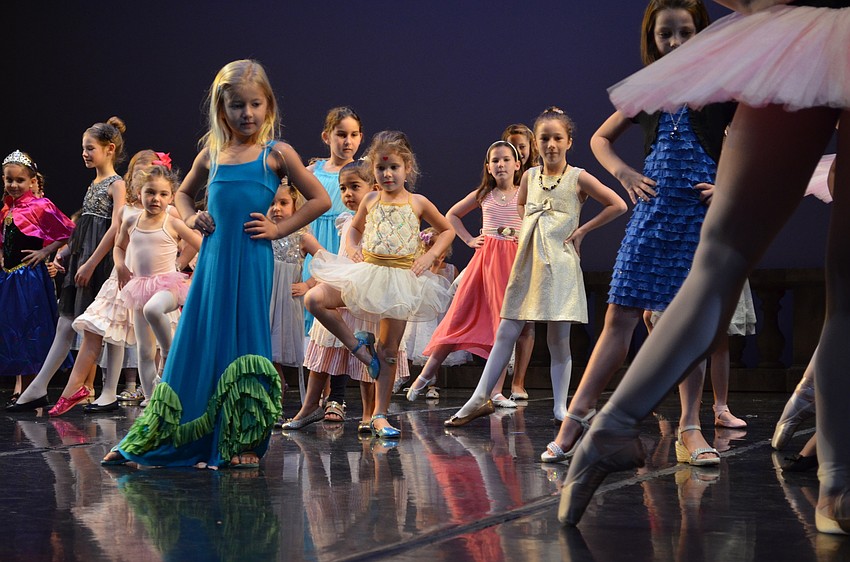 Young dancers learn ballet basics.