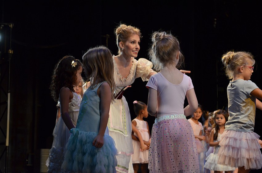 Sarasota Ballet Principal dancer Kate Honea leads dancers on stage.