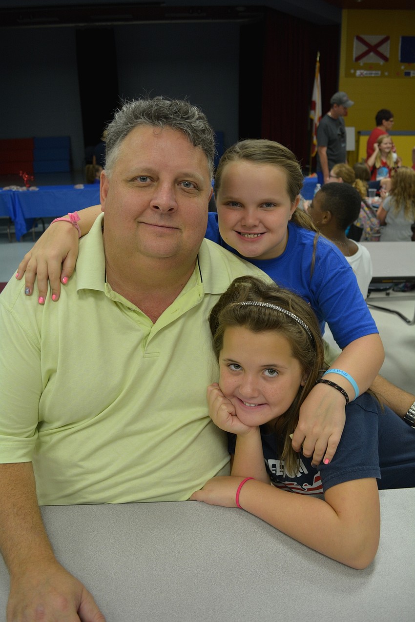 Russell Black hangs out with his daughters, Sarah and Ashley.