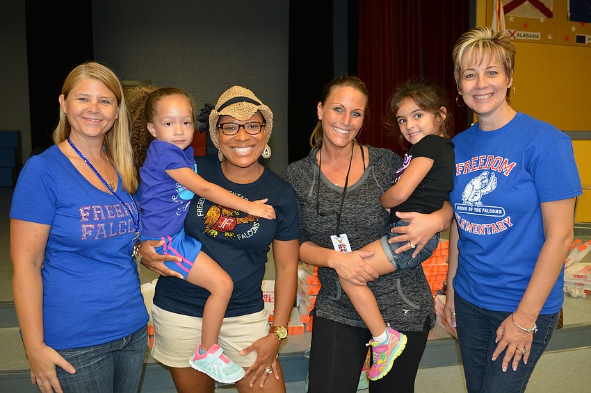 PTO volunteers Shelley Merritt, Ashley and Dee Voshell, Jen and Payton Franczyk and Shawna Hicks-Cranston ran out of doughnuts there were so many attendees.