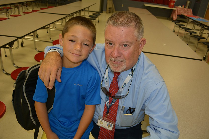 Caleb Mutch enjoys the morning with his stepfather John Kennedy.
