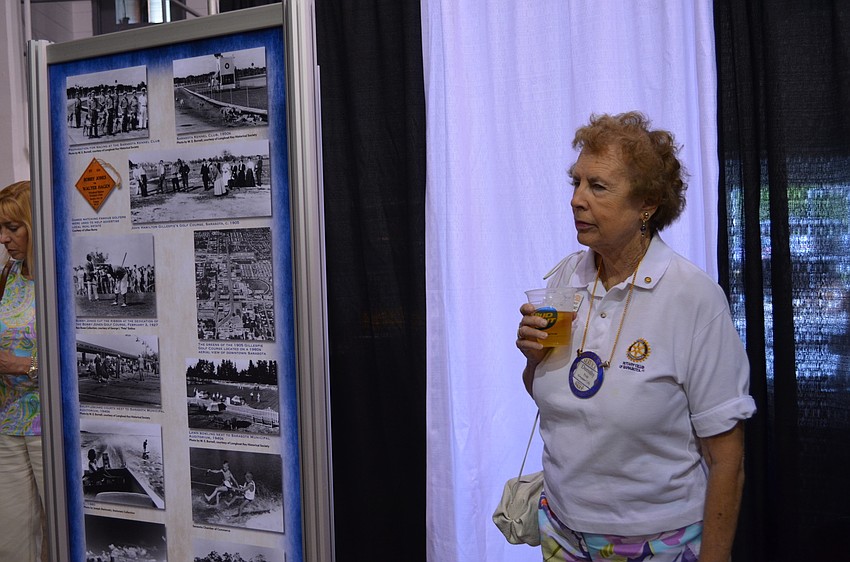 Dorothy Stockbridge takes in the photographs from over the years.
