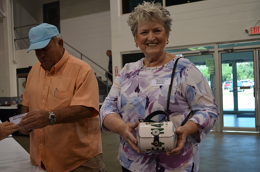 Marilyn Gaines shows off her Florida license plate purse.
