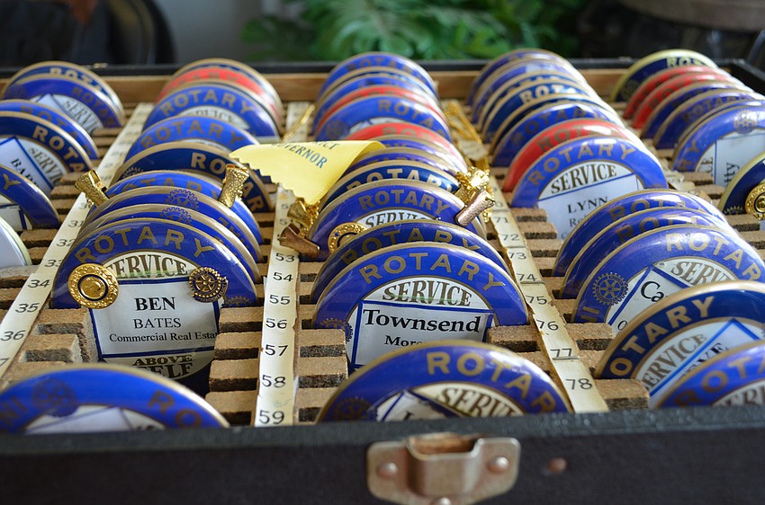 Rotary badges waiting to be picked up by members.