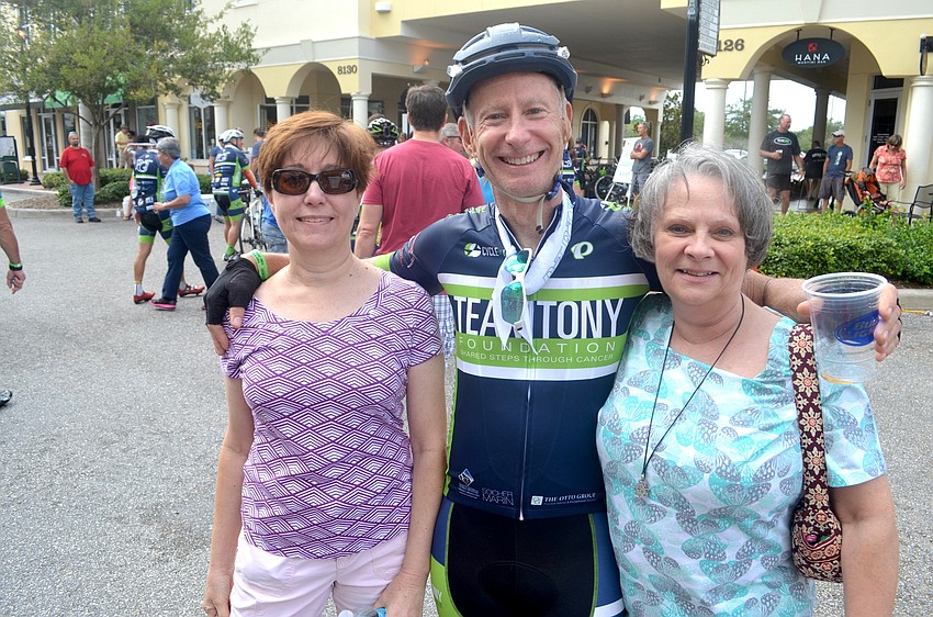 Bob Kilcullen (center) is greeted by his wife, Sharon, and sister, Linda at the finish line.