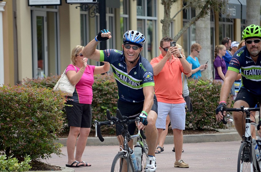 Eric Ressel cheers at the end of the bike ride.