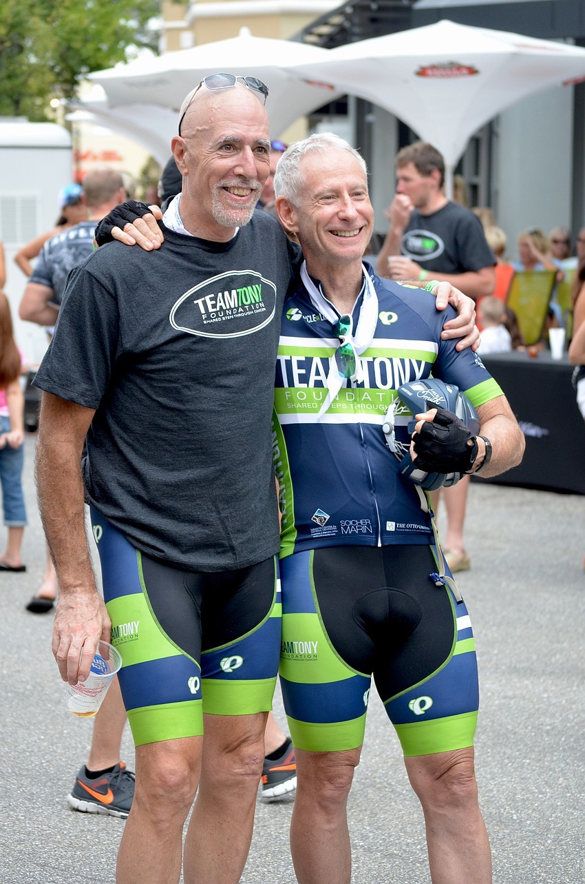 Friends and bike riders Sam Stern and Bob Kilcullen pose for a photo opp. after a long two-day ride.