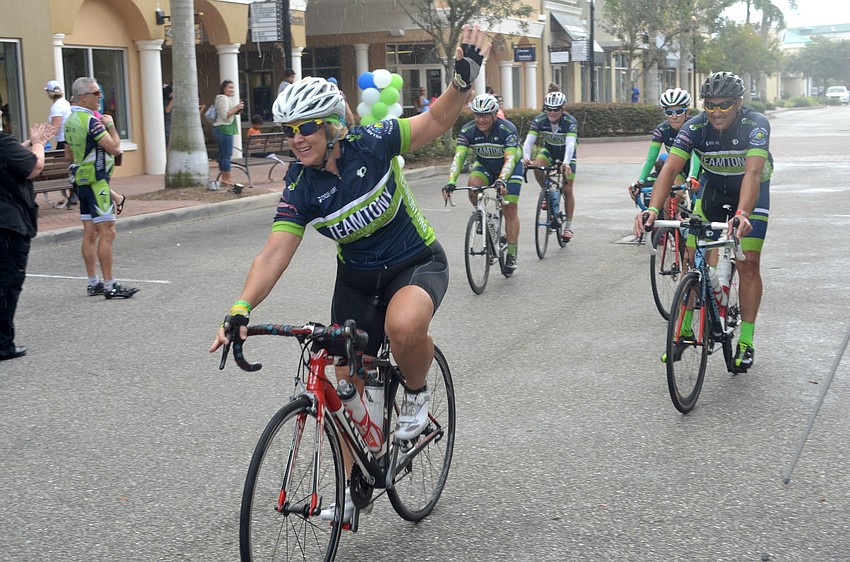 Wendy Abner leads a group of riders sown Main Street.