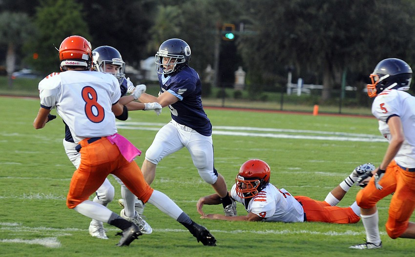 ODA junior running back Jason Fineberg breaks a tackle in the first quarter.