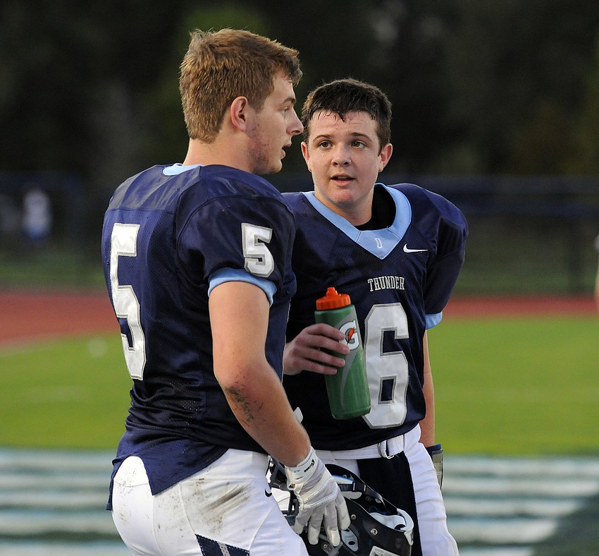 ODA running back Jason Fineberg talks with quarterback Anthony Squitieri during the Thunder's district game versus Bradenton Christian.