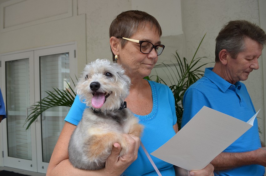 Scotty takes a look at the crowd while Christine Sporrer follows along with the service.