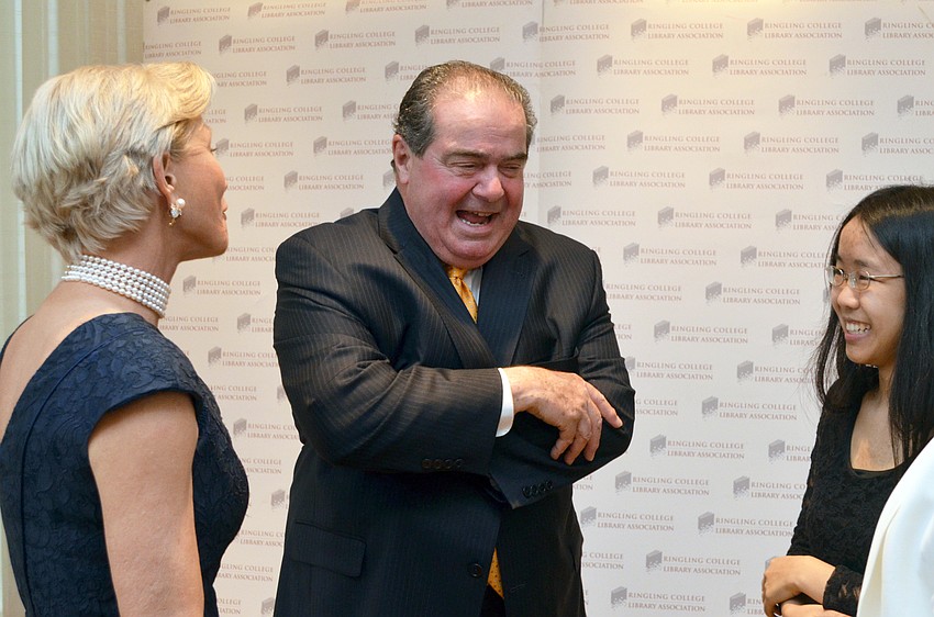 Town Hall 2015 Chairwoman Nancy Morgan, featured speaker Supreme Court of the United States Associate Justice Antonin Scalia and Ringling College of Art and Design student Grace Cheung mingle after the presentation of Justice Antonin Scalia’s portrait.