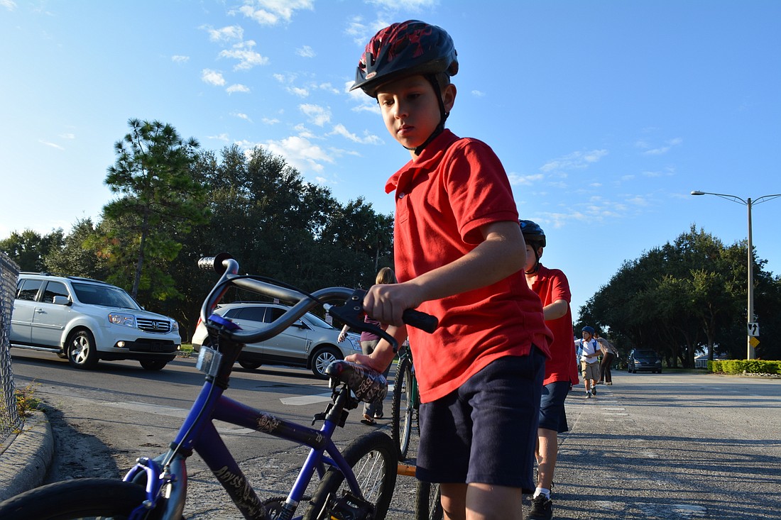 William Pope, 8 bicycled two miles with his brother, Andrew, and dad, Robert.