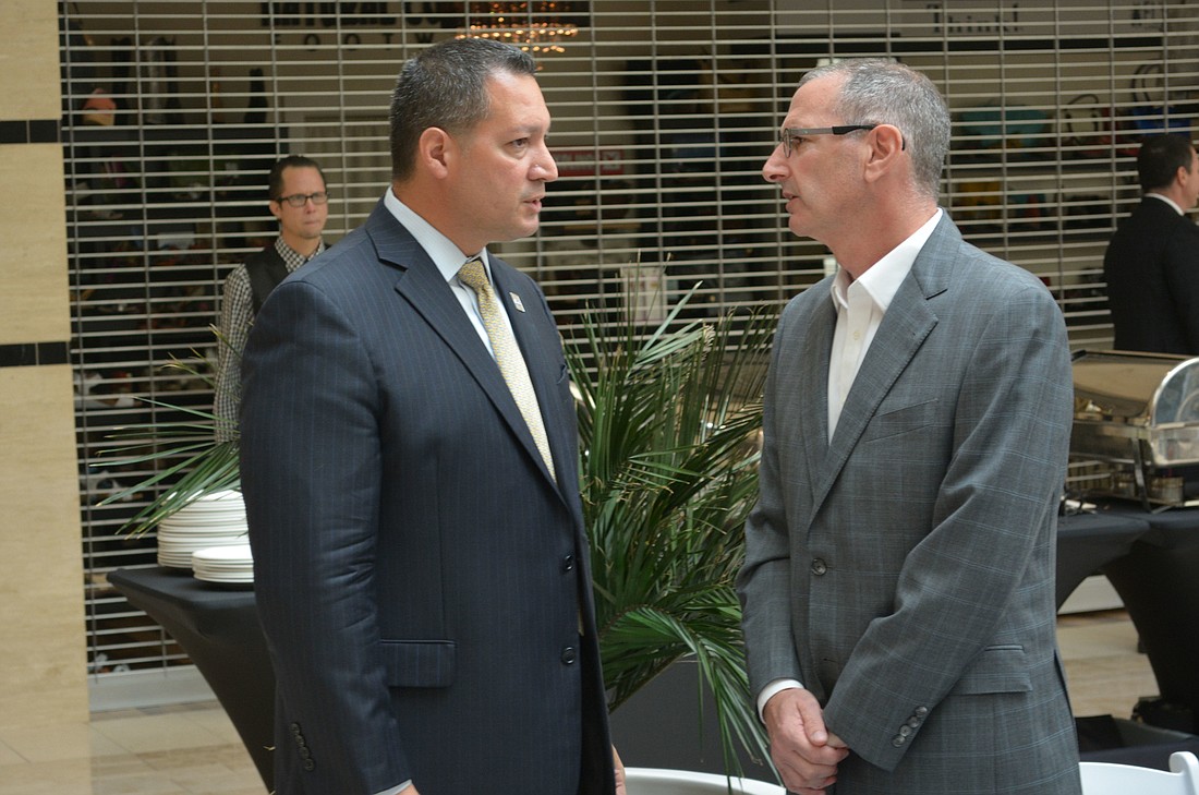 Mall General Manager Octavio Ortiz and Benderson Development Executive Director of Leasing Mark Chait chat following the press conference.