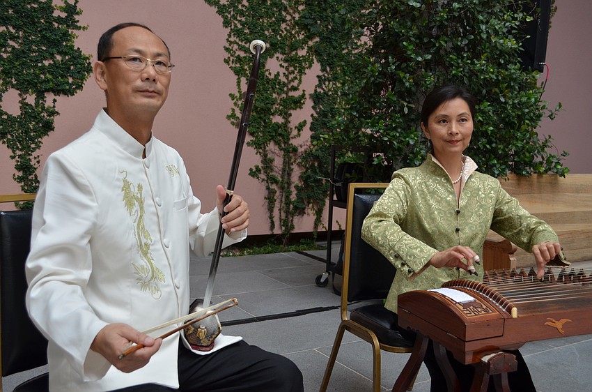 Arui Yang and Luo Wu perform traditional Chinese folk songs for the preview party.