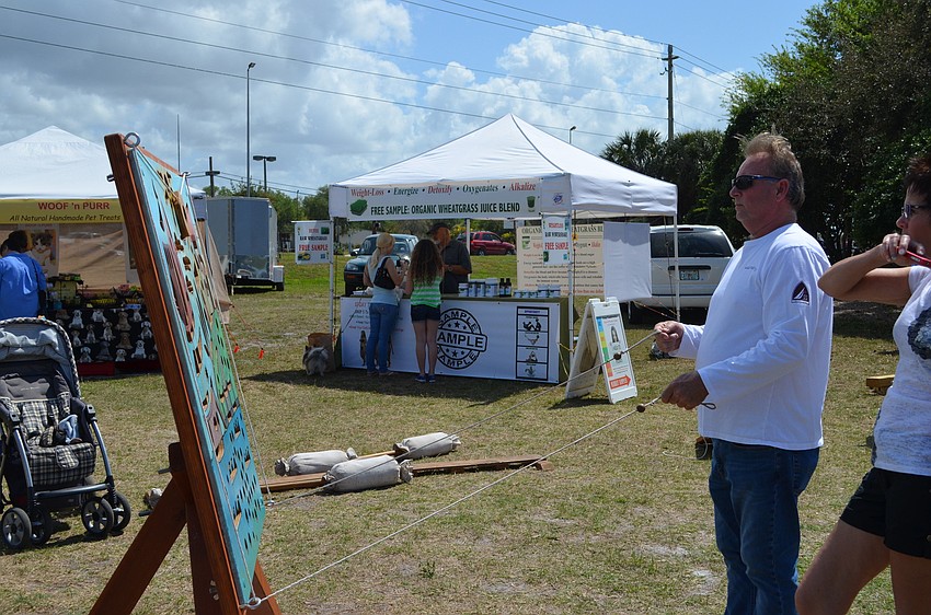 David Cornstadt plays a marble game.