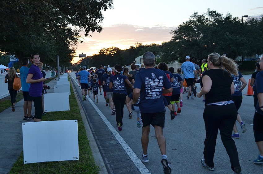 Participants take off for the 1-mile Fun Run.