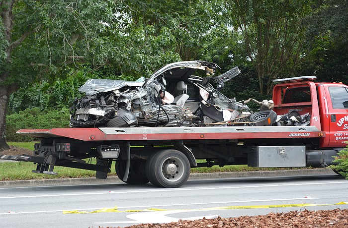 The vehicle separated into two pieces after crashing into a tree.