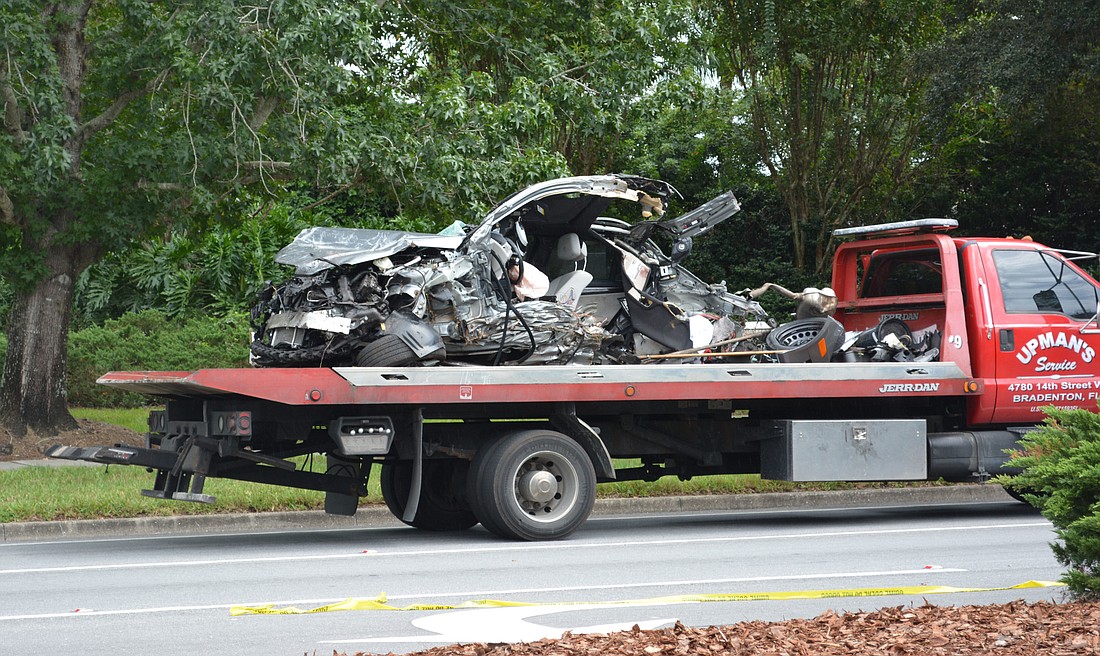 The vehicle separated into two pieces after crashing into a tree.