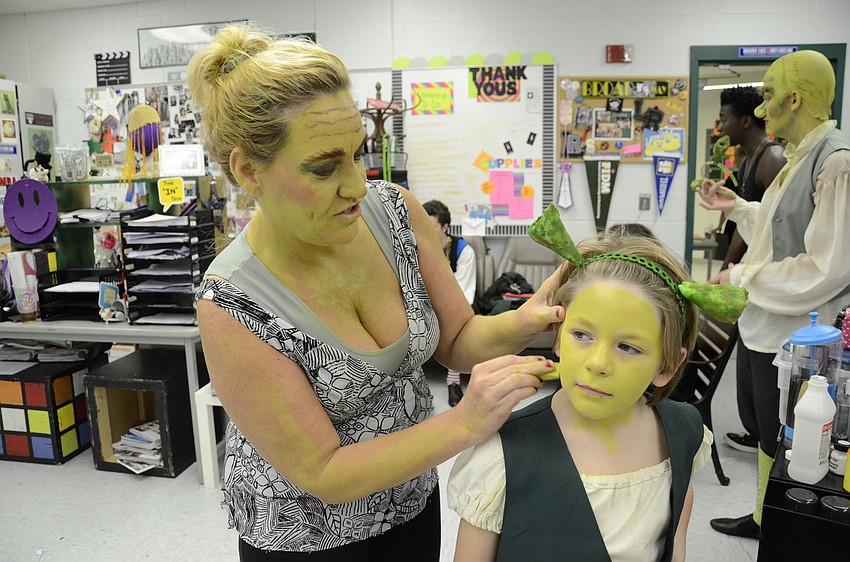 Mandy Kersey, who plays Mama Ogre, does the makeup for Ethan Hall, who plays Young Shrek.