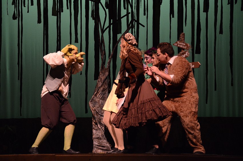 Shrek, played by Jackson Helwege, tried to scare the Duloc citizens from his swamp.